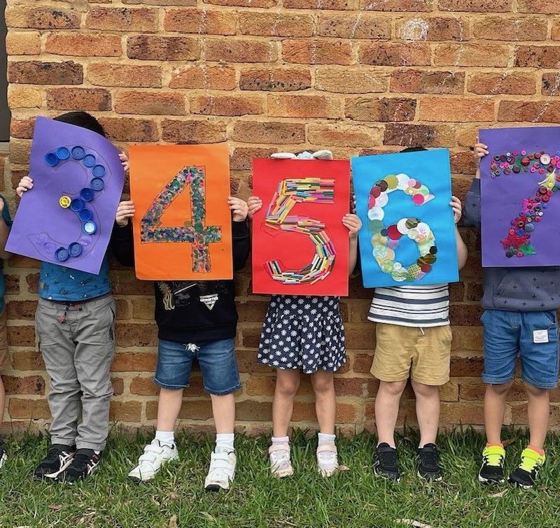 Pre school children holding numbers