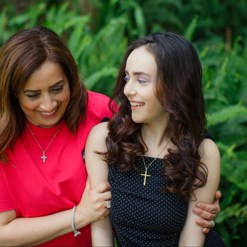 Mum and young daughter laughing