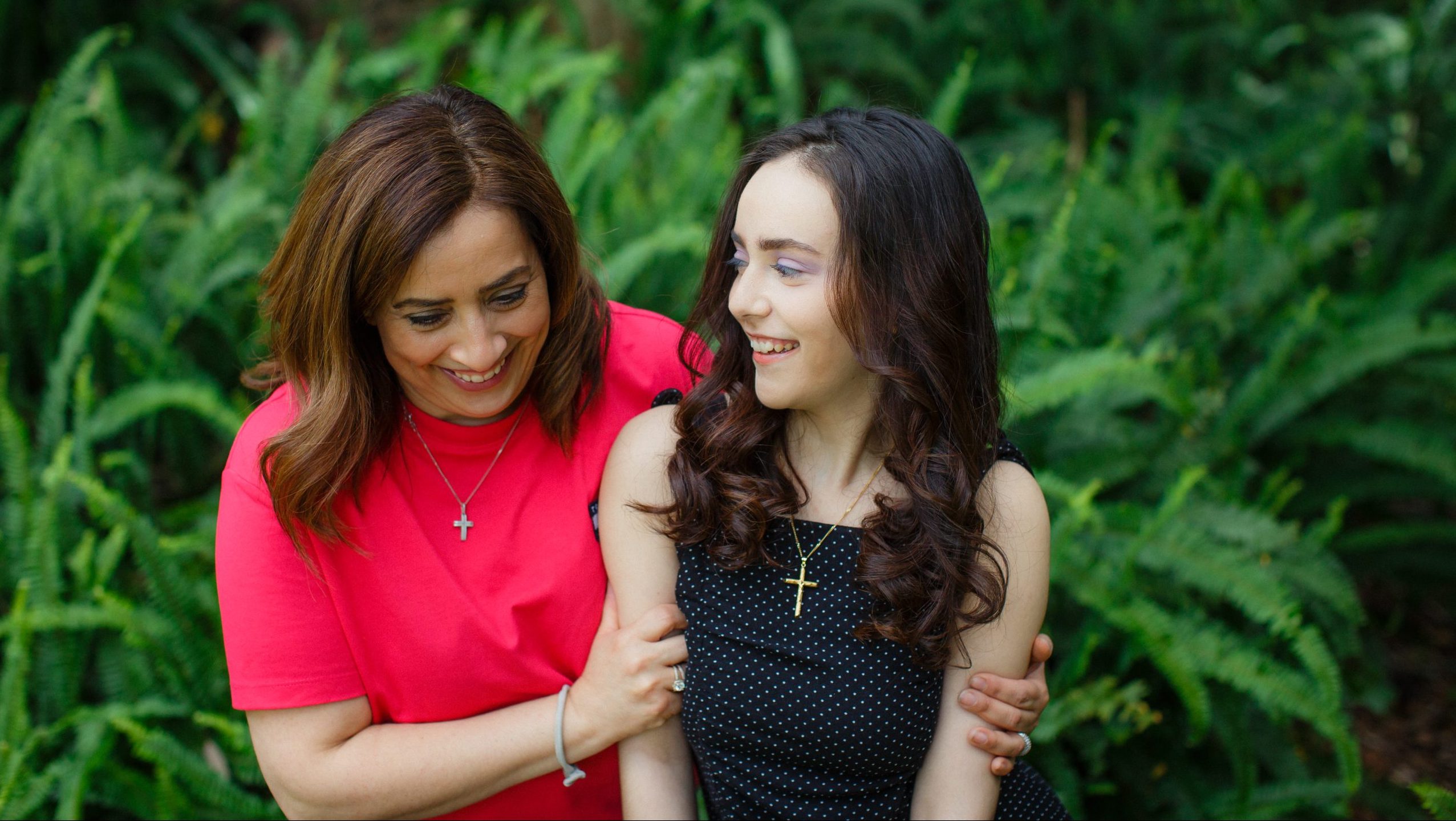 Mum and young daughter laughing