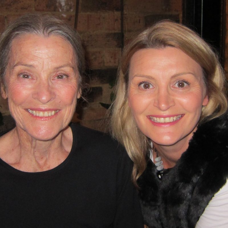 2 women, mother and daughter smiling