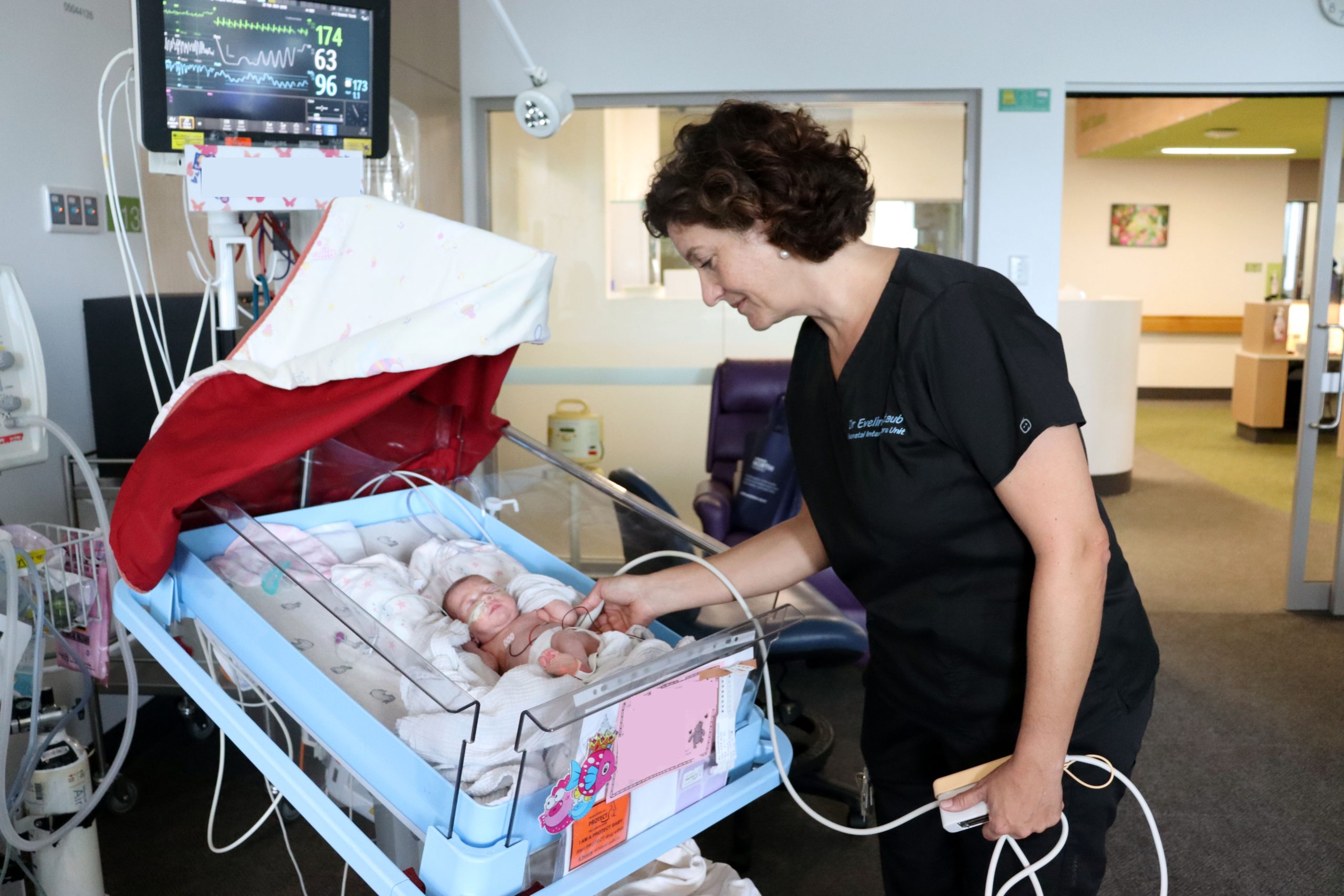 Dr Eveline Staub with baby in NICU